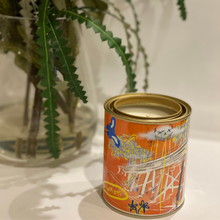 Load image into Gallery viewer, A 420-gram cocosoy candle in a unique paint tin with artwork by Lachlan Muller, gloss laminate finish, and up to 80 hours of burn time. Ideal for upcycling into a pen holder or makeup brush holder.