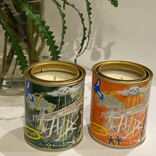 Load image into Gallery viewer, A 420-gram cocosoy candle in a unique paint tin with artwork by Lachlan Muller, gloss laminate finish, and up to 80 hours of burn time. Ideal for upcycling into a pen holder or makeup brush holder.