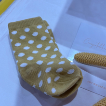 Load image into Gallery viewer, A personalised baby hamper featuring a hand-poured soy candle with the baby’s name, date, weight, and time of birth, a matching 100ml nursery spray, baby socks, and a knitted rattle, all enclosed in a magnetic close hamper box with a custom card and double-sided satin bow. Ships within 24 hours.