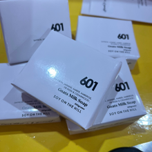 Load image into Gallery viewer, A 100-gram bar of 601 Baccarat Rouge inspired goat milk soap with a creamy ‘custard’ color, individually wrapped. Made with nourishing ingredients like coconut oil, palm oil, safflower oil, and kosher glycerine. Hypo-allergenic, non-comedogenic, biodegradable, and gluten-free.