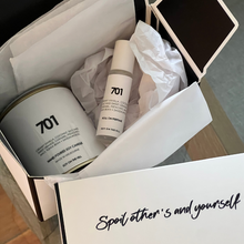 Load image into Gallery viewer, Gift pack featuring a small paint tin candle and roll-on perfume, beautifully boxed with a double-sided satin bow and tag, with a Brazilian Bum Bum fragrance.