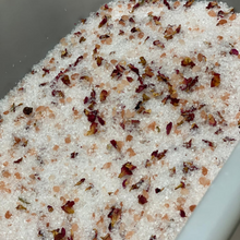 Load image into Gallery viewer, Indulge in our luxurious 600-gram bath salts, designed to soothe and relax after a long day. Made with a blend of magnesium and Himalayan rock salt, these bath salts are available in two delightful options:  	•Lavender essential oil with lavender petals 	•Rose essential oil with miniature rose petals  Perfect for unwinding and rejuvenating your senses.
