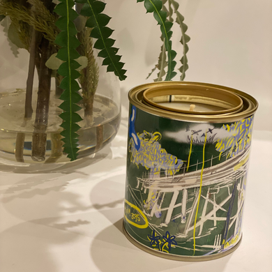 A 420-gram cocosoy candle in a unique paint tin with artwork by Lachlan Muller, gloss laminate finish, and up to 80 hours of burn time. Ideal for upcycling into a pen holder or makeup brush holder.